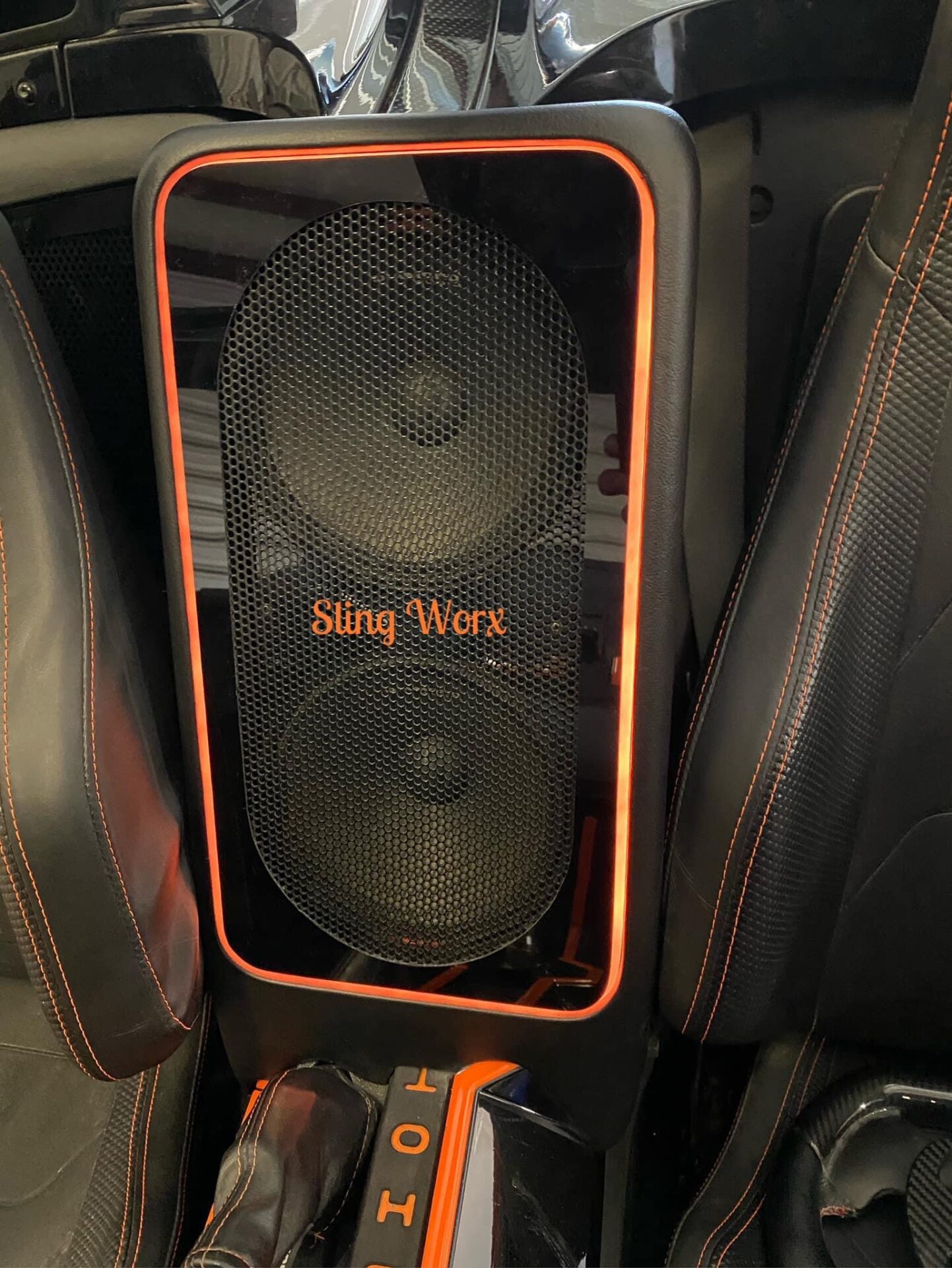 Black and orange Sling Worx speaker