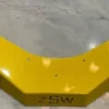 A yellow metal object with a corner